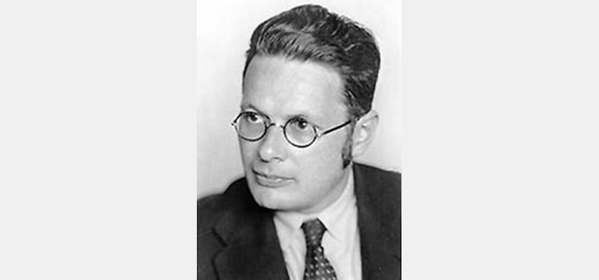 Porträtfoto, Mann mit Brille, Anzug und Koteletten, schwarz-weiß